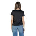 Back view of Liu Jo Black V-Neck Women’s T-Shirt paired with blue jeans