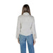 Back view of Jacqueline De Yong Women’s white turtleneck shirt with bell sleeves and jeans