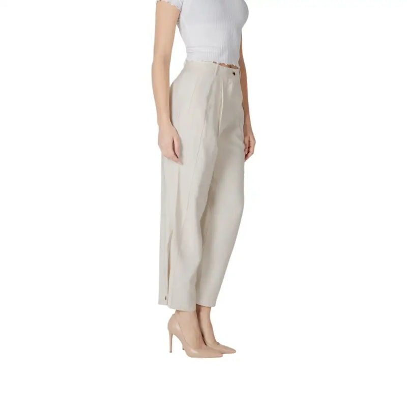 Beige high-waisted wide-leg trousers with subtle pleated front and side slit from vila clothes spring summer collection