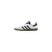 White Adidas Samba sneaker featuring black accents and classic sporty design