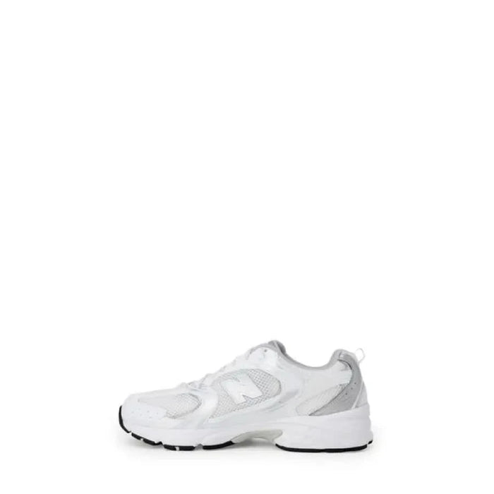 White athletic shoe featuring New Balance Women’s Grey Sneakers in Faux Leather design