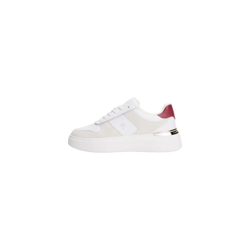 White and beige leather Tommy Hilfiger women’s sneakers with red heel accent and silver details
