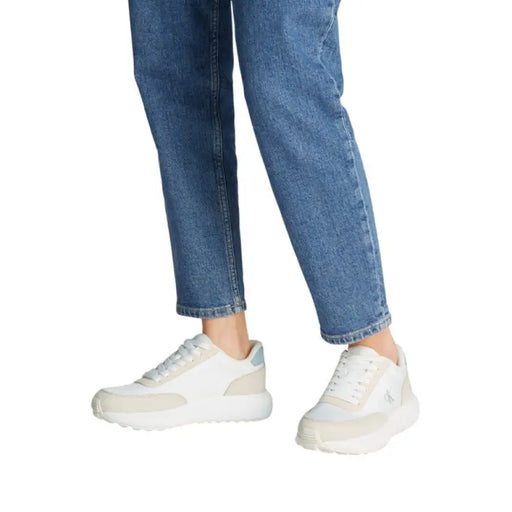 White and beige Calvin Klein sneaker displayed in a product image