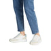 White and beige Calvin Klein sneaker displayed in a product image