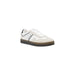 White and black Tommy Jeans sneaker with gray accents displayed in product image