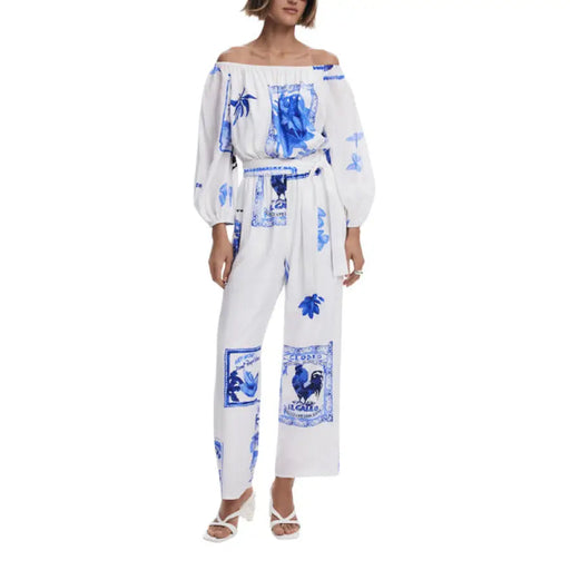 White and blue patterned off-shoulder jumpsuit with floral tile print for stylish wear