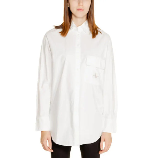 White button-down shirt displayed on a product page for men or women