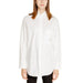 White button-down shirt displayed on a product page for men or women