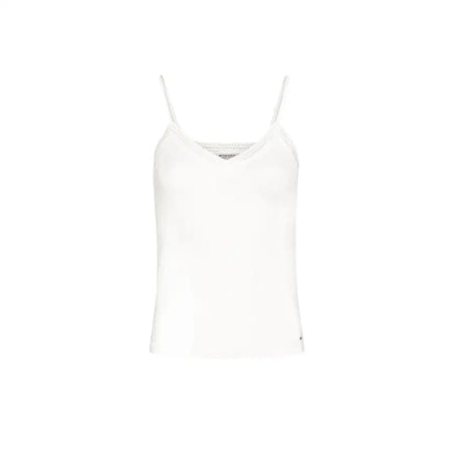 White camisole top displayed on a mannequin in a retail clothing store