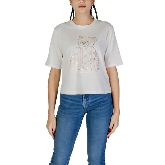 White cropped t-shirt featuring a teddy bear design from Guess Active collection