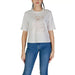 White cropped t-shirt featuring a teddy bear design from Guess Active collection
