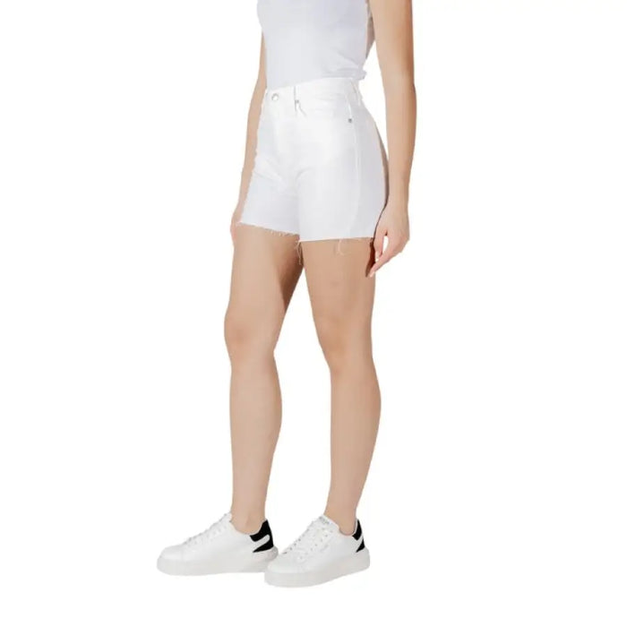 White denim shorts with frayed hem, styled for casual summer wear