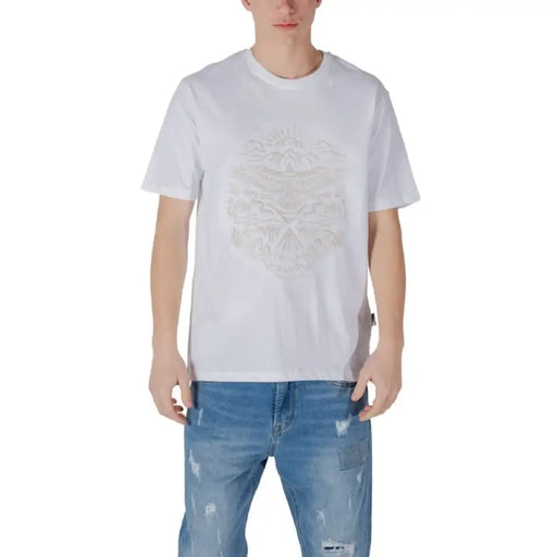 White graphic T shirt styled with Blue Jeans in a fashionable casual outfit