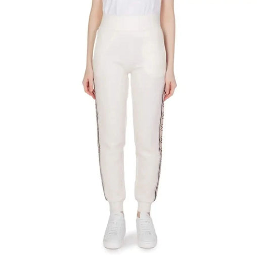 White Guess Active Women’s Cotton Trousers featuring decorative side stripes
