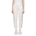 White Guess Active Women’s Cotton Trousers featuring decorative side stripes