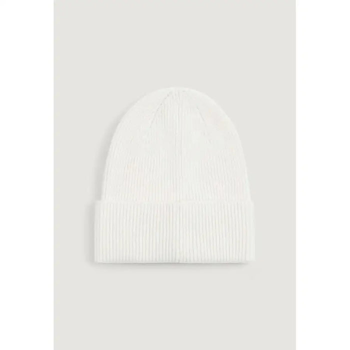White ribbed knit beanie displayed against a neutral background