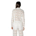 White lace blazer and pants set displayed on a mannequin for elegant formal wear