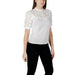 White lace-trimmed blouse paired with black pants for women in a fashionable outfit