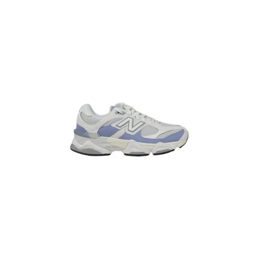White and lavender New Balance sneaker displayed in a product image