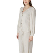 A soft cream-colored viscose blouse for women featuring long sleeves, v-neck, button-up front, and subtle pleats