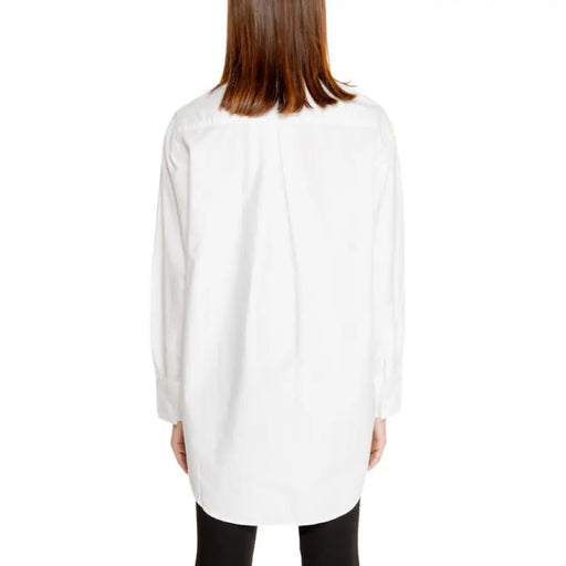 White long-sleeved button-down shirt displayed in the White Button Down Shirt product image