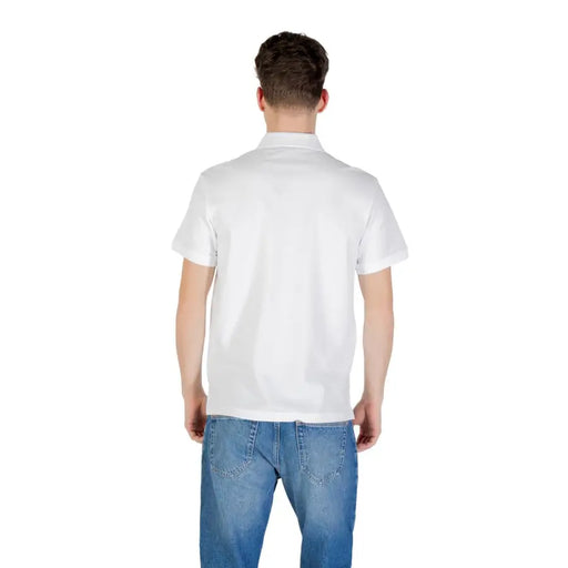 Men’s White Polo Shirt and Blue Jeans displayed on a model