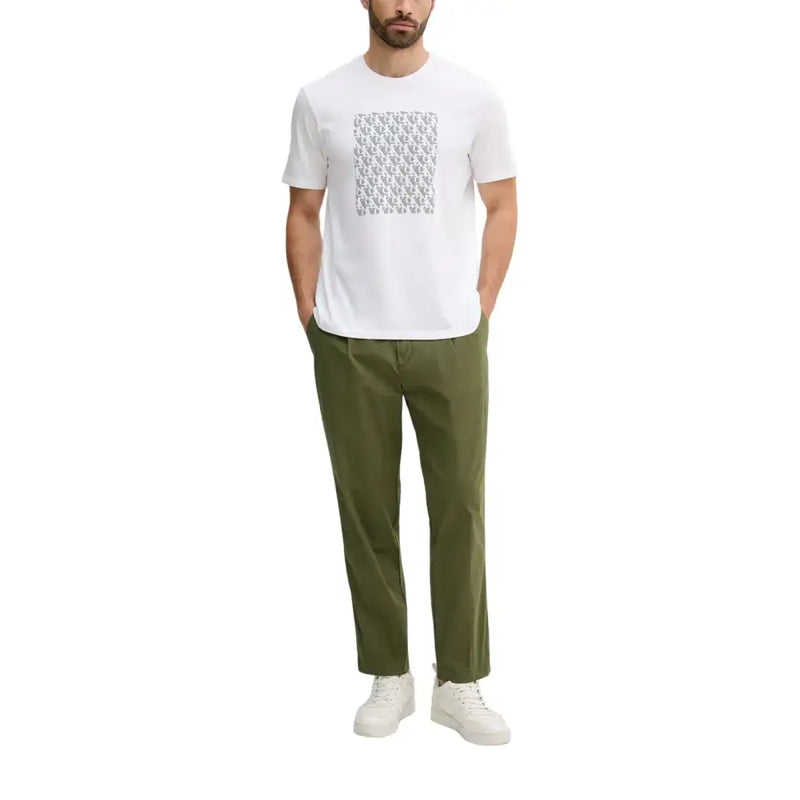 White short sleeve t shirt with a gray monogram pattern across the chest made of soft breathable fabric
