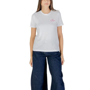 White short-sleeve round neck cotton T-shirt paired with dark wash wide-leg jeans for women