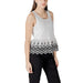 White sleeveless top featuring elegant black floral trim for stylish summer wear