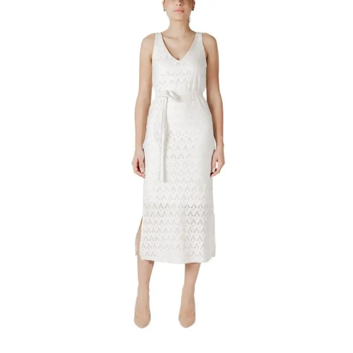 White sleeveless midi dress from Navy Blue Midi Dress Collection displayed in a stylish setting
