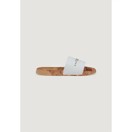 White slide sandal with a cork sole featuring white leather and a subtle map print on the sole