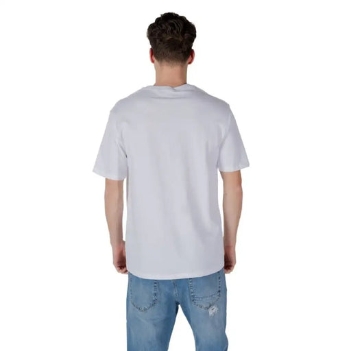 White T shirt with graphic design paired with classic Blue Jeans in a stylish outfit