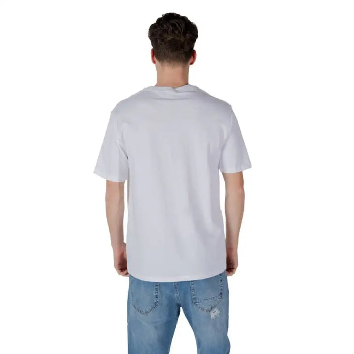 White T shirt with graphic design paired with classic Blue Jeans in a stylish outfit