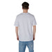 White T shirt with graphic design paired with classic Blue Jeans in a stylish outfit