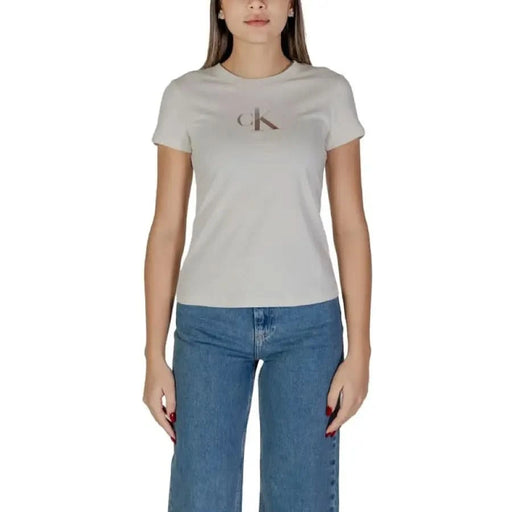 White minimal logo t-shirt paired with blue jeans in Calvin Klein Jeans collection