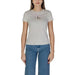 White minimal logo t-shirt paired with blue jeans in Calvin Klein Jeans collection