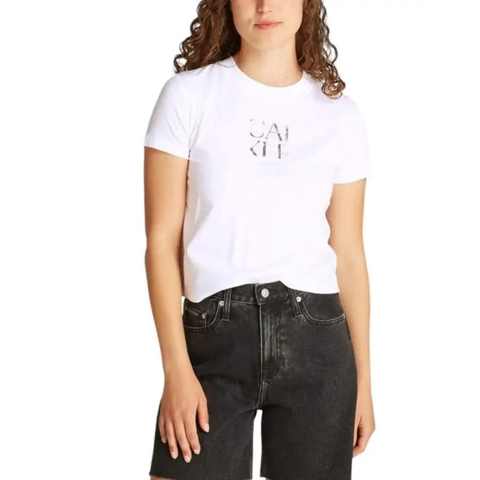 White Calvin Klein Jeans Organic Cotton T-Shirt with minimal print paired with black jeans