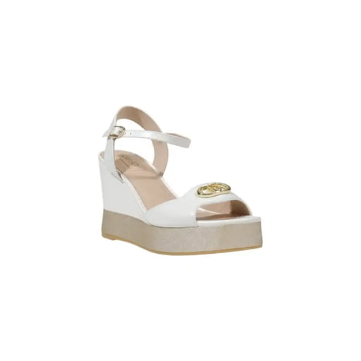 White wedge sandal with ankle strap ideal for casual and formal occasions
