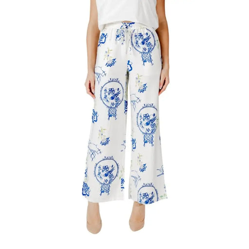White wide-leg pants featuring elegant blue and yellow patterns for stylish outfits