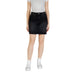 Woman wearing a black denim skirt showcasing a Light Blue Denim Mini Skirt product