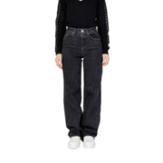 Woman wearing Women’s Black Wide Leg Jeans and black top showcasing stylish attire