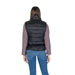 Woman in a black puffer vest from B.young with turtleneck and front pockets