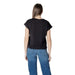 Woman wearing Liu Jo Black T Shirt and blue jeans showcasing casual fashion style