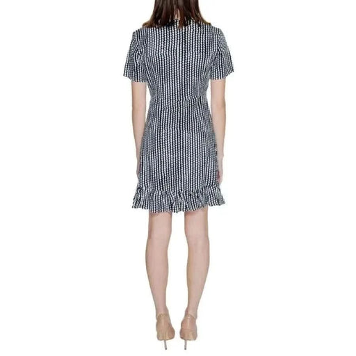 Urban style: Woman in black and white striped dress - Only Women Clothing