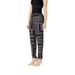 Woman modeling stylish Black and White Patterned Pants in a fashionable setting