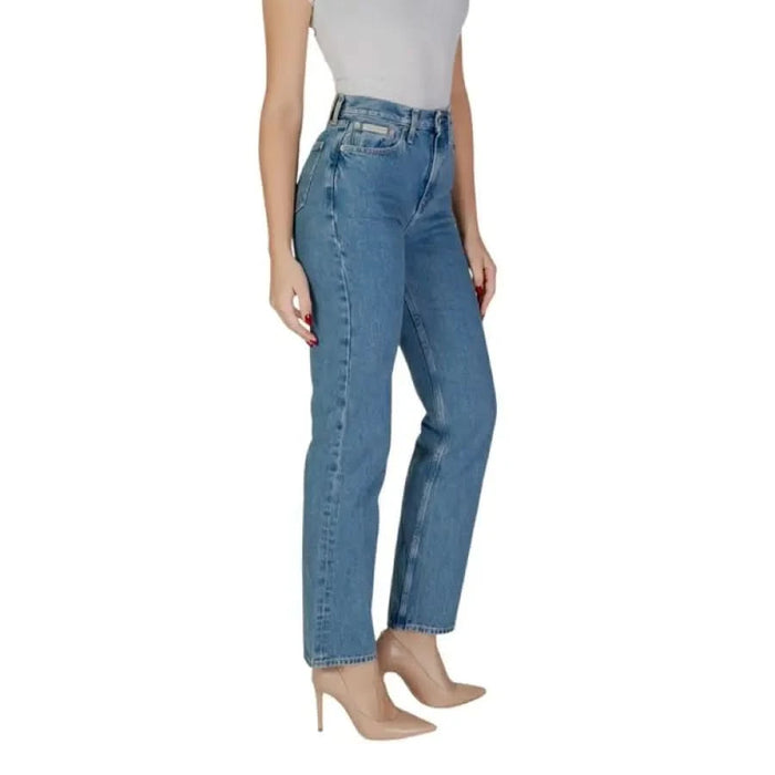 Woman showcasing Calvin Klein Women’s Blue Cotton Jeans in stylish blue denim