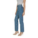Woman in blue cotton Calvin Klein jeans paired with elegant nude heels