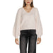 Woman wearing a cream-colored V-neck sweater with balloon sleeves from Women V Neck Sweater collection