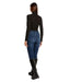 Woman in dark turtleneck, jeans, and boots showcasing Morgan De Toi Women’s Black Turtleneck Sweater