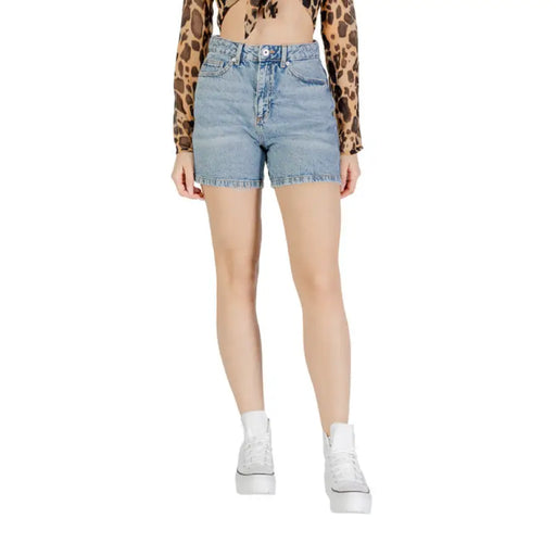 Woman wearing denim shorts and white platform sneakers for Womens Black Denim Shorts product